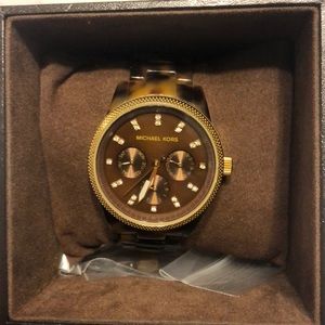 MK brown tortoise watch.